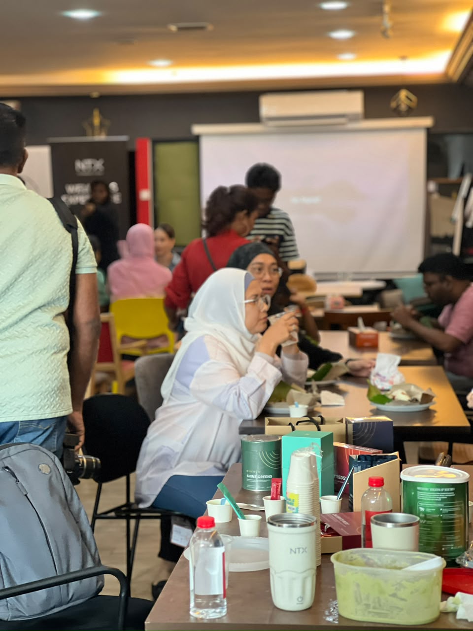Guests enjoying drinks and food during a team brainstorming session